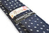 navy tie with white squared polka dot design